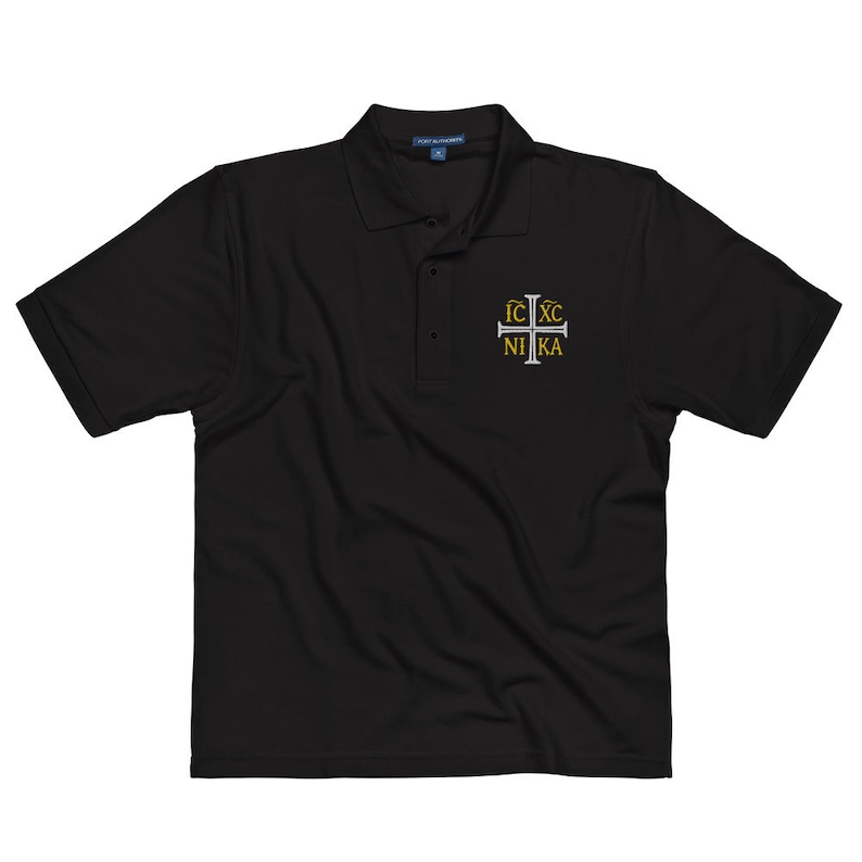 May include: Black polo shirt with a white embroidered cross and the text "IC XC NIKA" in gold.