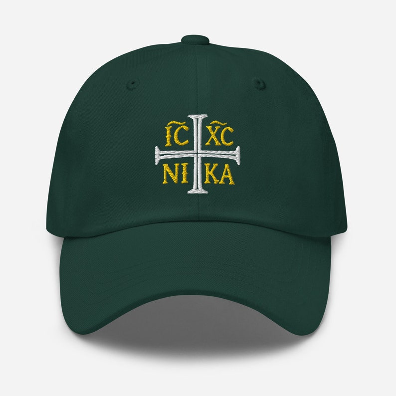 May include: A dark green baseball cap with a white cross and the text "IC XC NIKA" embroidered in gold.