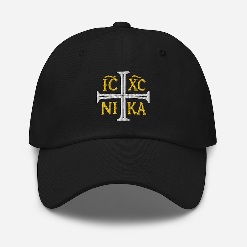 May include: A black baseball cap with a white cross and the text "IC XC NIKA" embroidered in gold.