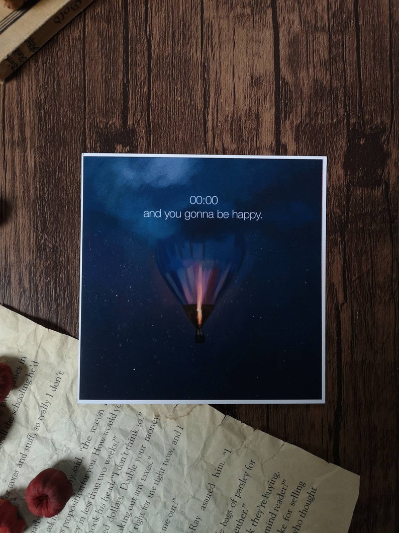 May include: A dark blue background with a hot air balloon floating in the sky. The balloon is glowing orange and purple. The text "00:00 and you gonna be happy." is displayed at the top of the image.