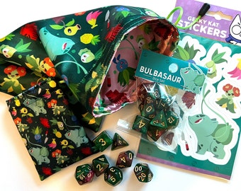 May include: Green dice bag with a Bulbasaur design and a matching smaller bag. The bag is filled with green and gold dice. A sheet of stickers with a Bulbasaur design and the text "Gelky Kat Stickers" is also shown.