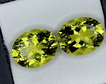 Par de gemas de quartzo verde dourado com lapidação oval | 18 quilates
