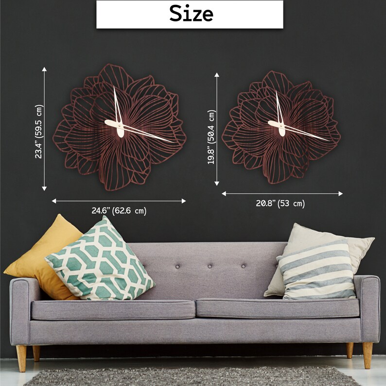 May include: Two sizes of a decorative wall clock with a floral design. The larger clock is 23.4 inches tall and 24.6 inches wide. The smaller clock is 19.8 inches tall and 20.8 inches wide. Both clocks have a dark brown wood finish and a white clock face.
