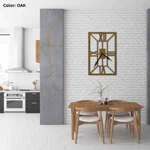 May include: A large, rectangular, wooden wall clock with Roman numeral markings and black hands. The clock is mounted on a white brick wall in a dining room setting. The clock is made of oak wood.