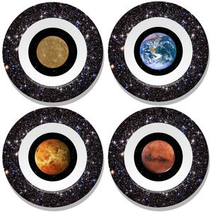 May include: Four round coasters featuring planets: Mercury, Earth, Venus, and Mars. Each coaster has a black center, a white ring, and a starry outer ring. The planets are depicted with realistic colors and textures.