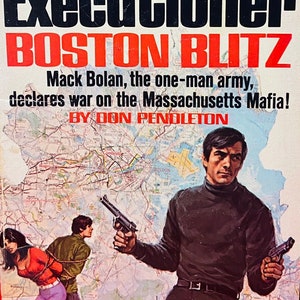 May include: A paperback book cover with the title "The Executioner: Boston Blitz" by Don Pendleton. The cover features a man holding a gun and a map of Boston.