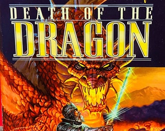 May include: A paperback book titled "Death of the Dragon" from the Forgotten Realms series. The cover features a dragon and a knight with a glowing sword. The book is part of The Cormyr Saga, Book III, by Ed Greenwood & Troy Denning.