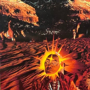May include: A book cover with the title "Sedona: Psychic Energy Vortexes" by Dick Sutphen. The cover features a colorful image of a man with a sun-like halo in a desert landscape.