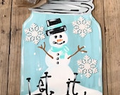 Snowman mason jar door hanger with 3D glitter snowflakes and bow