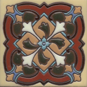 May include: A square ceramic tile featuring a symmetrical pattern in shades of terracotta, dark green, cream, and light blue. The design includes a central four-pointed star motif surrounded by curved scrollwork and geometric borders.