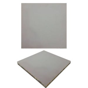 May include: Two white ceramic tiles, one lying flat and the other standing upright. The tiles are smooth and have a slightly textured surface.