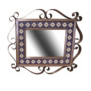 May include: A decorative mirror with a wrought iron frame and a tile border. The tiles are blue, red, and white with a floral pattern.