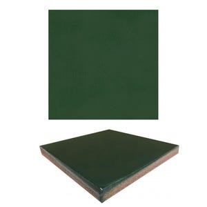 May include: A dark green ceramic tile with a smooth, glossy finish. The tile is square shaped and has a slightly textured edge.