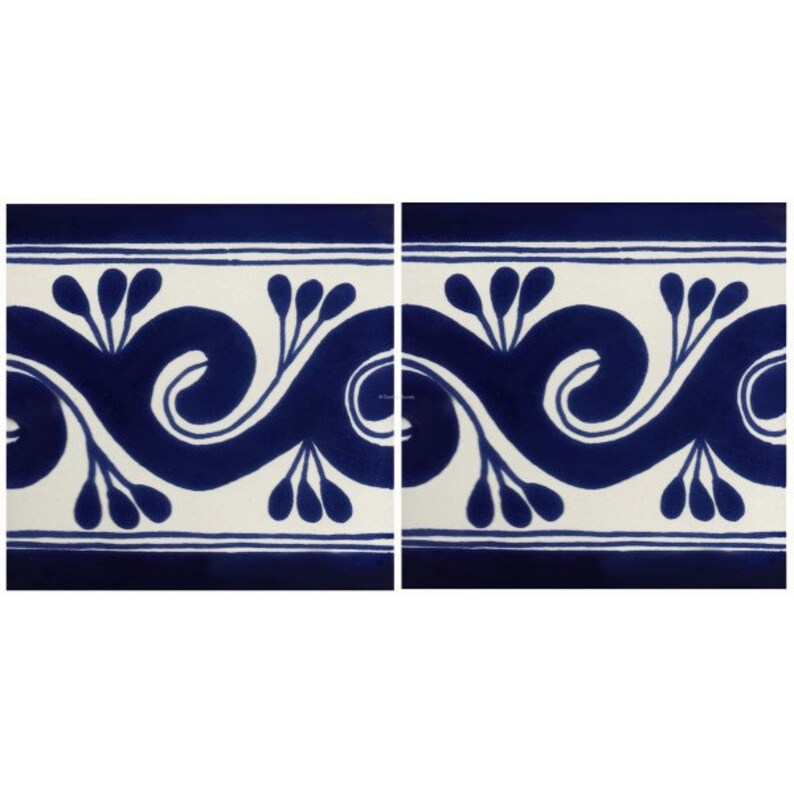 May include: Two square tiles with a repeating blue and white decorative pattern. The design features a stylized wave with floral elements. The border is a solid blue line. The background is white.