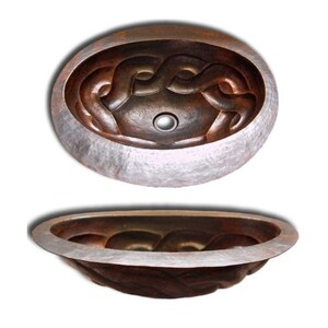 May include: An oval copper sink with a hammered finish and a Celtic knot design. The sink is shown from two angles.