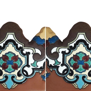 May include: Two identical decorative ceramic tiles featuring a scalloped top edge and a central floral motif. The design incorporates a color palette of deep brown, cream, teal, dark red, and black, arranged in symmetrical, intricate scrollwork patterns.