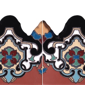 May include: A decorative border tile featuring a repeating scalloped edge and a central symmetrical motif. The design incorporates black, cream, red, teal, and blue enamel-like colors in a complex, interlocking pattern with curved lines.