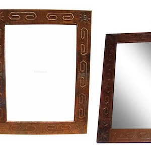 May include: Two ornate copper-colored mirrors with decorative geometric patterns around the frame. The mirrors are rectangular and have a reflective surface.