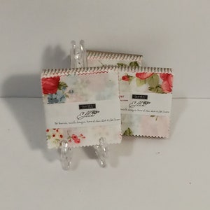 Ellie Mini Charm Pack by Brenda Riddle Designs for Moda Fabrics - 42 2 1/2 inch squares. Plaids, unique stripes and blossoming florals.