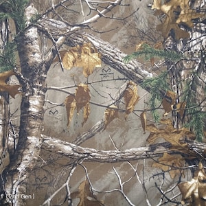 Realtree Xtra Edge bull DENIM camouflage fabric. Fabric is 60 inches wide denim. NOT cotton quilting fabric. Sold In 1/2 YARD Increments.