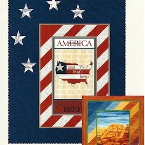 May include: A patriotic quilt pattern with a blue background and white stars. The main design features a red and white striped border around a central panel with the word "AMERICA" and a map of the USA. The throw measures 62" x 80".