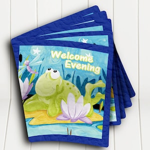 May include: A stack of blue quilted fabric squares with a frog, dragonfly, and lily pad design. The fabric squares have the text "Welcome Evening" printed on them.