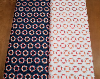 Ahoy Baby Life Preservers by Deane Beesley Designs for P&B Textiles 05015 Red and orange against white or blue. SOLD IN 1/2 YARD increments.