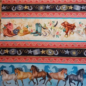 May include: Cowboy-themed fabric with repeating patterns. The design includes cowboy boots, hats, saddles, horseshoes, and belt buckles. The fabric features a color palette of red, black, turquoise, and tan, with a light blue background.
