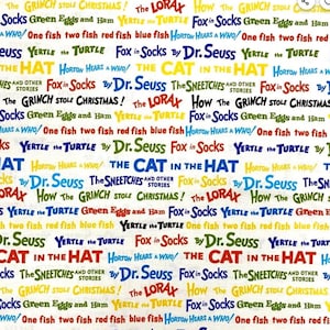 May include: A white background with a repeating pattern of Dr. Seuss book titles in various colors. The titles include "The Cat in the Hat", "Horton Hears a Who!" and "Green Eggs and Ham".