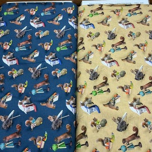 May include: Two bolts of cotton fabric featuring a repeating pattern of squirrels engaged in various activities, including holding books, knitting, and carrying baskets. The fabric on the left is dark blue, while the fabric on the right is tan.