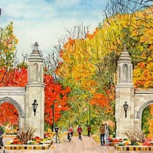 May include: Watercolor painting of a university entrance with two stone towers and an arched gateway. An American flag flies in the background. The scene is filled with autumn foliage in shades of red, orange, and yellow, with people walking and biking.
