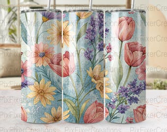 May include: Three stainless steel tumblers with a floral design. The design features watercolor flowers in shades of pink, yellow, and purple, set against a light blue background. The flowers include tulips, daisies, and lavender. Each tumbler has a silver straw.