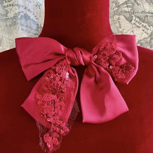 Papillon rosso con perline