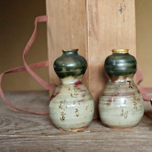 A pair of Kintsugi Tokkuri bottles and cups, Japanese antique porcelain sake bottle and cups with old words in Kanji  H3.9in/10cm