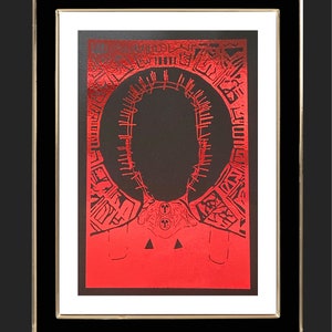 May include: A red and black print of a person's head with a crown of thorns. The print is framed in a black frame with a gold border.