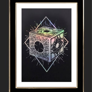 May include: A holographic print of a complex, intricate cube with a circular design in the centre. The cube is surrounded by a diamond shape with radiating lines.