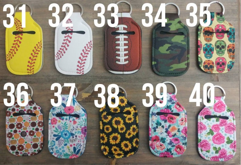 May include: Ten different hand sanitizer bottle holders with keychains. The holders are made of neoprene and have various designs, including baseball, football, camouflage, skulls, donuts, flowers, and sunflowers.