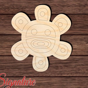 May include: A wooden cutout of a traditional Puerto Rican symbol, the Vejigante, with a circular face and five arms. The cutout is unpainted and has a natural wood finish.