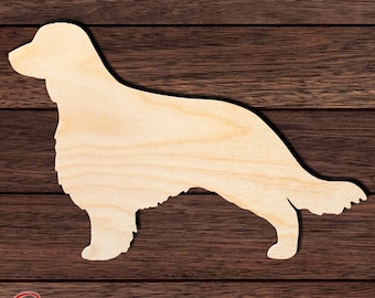 May include: A light-colored wooden cutout in the shape of a dog standing in profile. The silhouette features a long, flowing tail, feathered fur on the chest and legs, and a distinct head shape. The wood grain is visible across the entire surface.