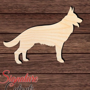 May include: A wooden cutout of a German Shepherd dog in profile. The cutout is made of unfinished wood and is ready to be painted or stained.