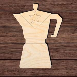 May include: A wooden cutout of a coffee maker, featuring a star design on the top section. The coffee maker is light brown and has a handle and spout. The background is a dark brown wood grain.