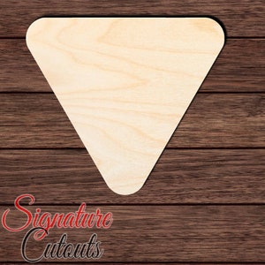 May include: A wooden, unfinished triangle shape with rounded corners. The light-colored wood grain is visible. The shape is set against a dark brown wood-grain background. The text "Signature Cutouts" is in the lower left corner.
