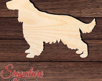 May include: A light-colored wooden cutout in the shape of a standing spaniel dog. The silhouette features a long body, feathered ears, and a bushy tail, showcasing the natural grain and smooth texture of the unfinished wood material.