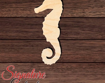 May include: A light-colored, flat wooden seahorse cutout with a smooth surface and a curled tail. The seahorse is oriented vertically, showcasing a natural wood grain texture and a distinct silhouette of the marine creature's head, body, and fins.