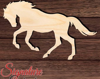 May include: A light-colored wooden cutout in the shape of a horse in a galloping pose. The horse is depicted with its head lowered, mane flowing, and tail extended. The text Signature Cutouts is visible in the bottom left corner.