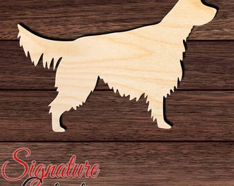May include: A light-colored wooden cutout in the shape of a standing dog with long, feathered fur on its tail and legs. The silhouette features a pointed snout, upright ears, and a distinct profile of a canine standing in a side-facing position.