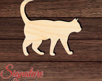 May include: A flat, light-colored wooden cutout in the shape of a walking cat with its tail curved upward. The silhouette features a pointed ear, a rounded back, and four legs in a stride position, showcasing the natural grain of the wood material.