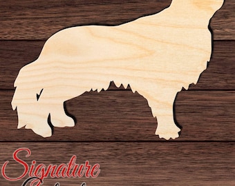 May include: A light-colored wooden cutout in the shape of a long-haired dog standing in profile. The silhouette features a detailed outline of the canine's head, back, and bushy tail, showcasing the natural grain and texture of the wood material.
