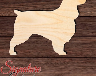 May include: A light-colored, flat wooden cutout in the shape of a dog standing in profile. The cutout features a smooth, natural wood grain texture and clearly defined edges, representing the silhouette of a canine with a short tail and ears.