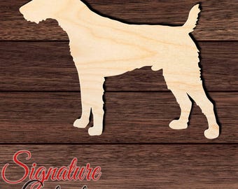 May include: A light-colored, unfinished wooden cutout in the silhouette shape of a standing terrier dog. The cutout features a smooth, flat surface with visible natural wood grain patterns, showing the dog in a side profile view.
